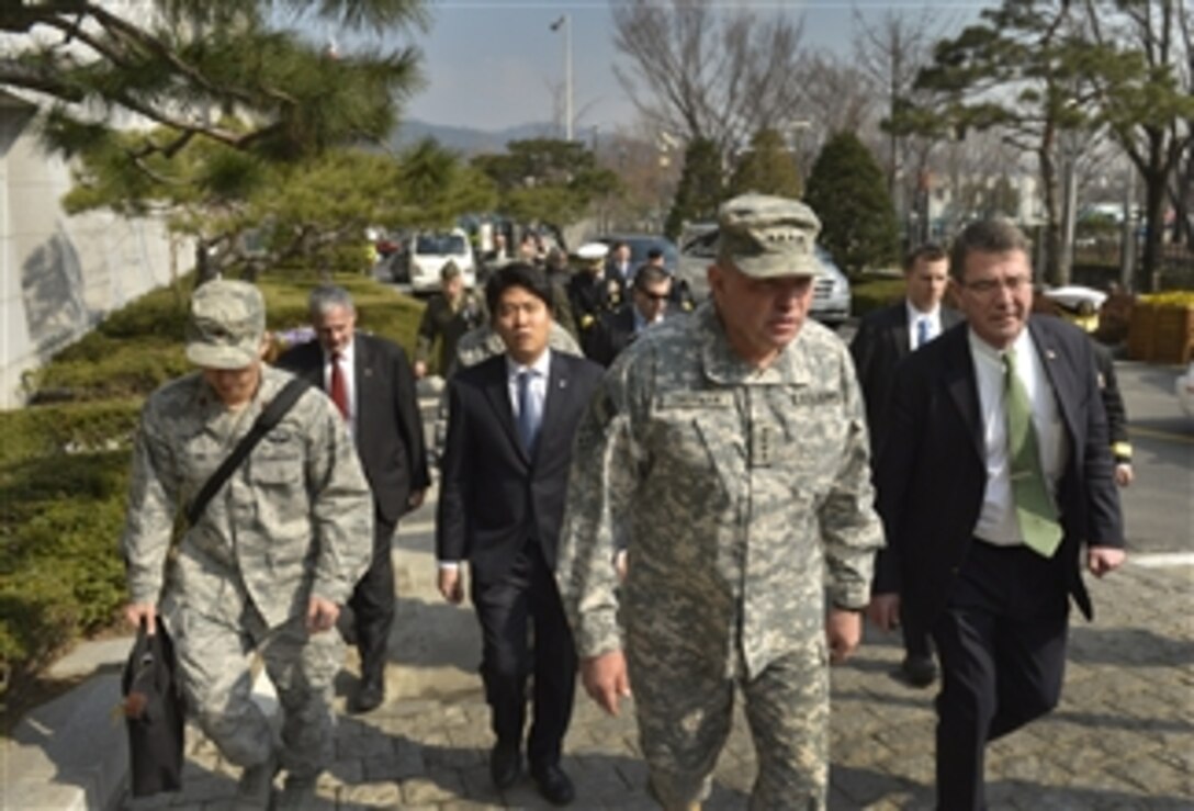 Deputy Secretary of Defense Ashton B. Carter, right, talks with Gen. James D. Thurman, commander, United States Forces Korea, as they walk from the U.S. Embassy to the nearby Korean Ministry of Foreign Affairs and Trade in Seoul, South Korea, on March 18, 2013.  Carter is meeting with Korean leaders to discuss the rebalancing of U.S. forces to the Asia-Pacific region and as well as the recent provocative actions by North Korea.  