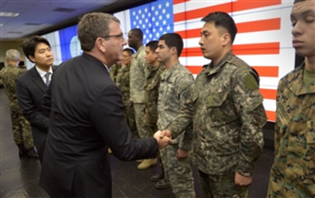 Deputy Secretary of Defense Ashton B. Carter thanks U.S. and South Korean soldiers assigned to the Joint Operations Center of Command Post Tango near Seoul, South Korea, on March 18, 2013.  Carter thanked the troops for their service and reminded them to thank their family members for the sacrifices they make in serving their countries.  