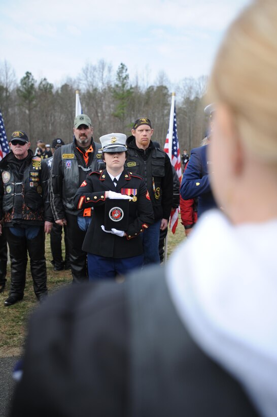 Lance Cpl. Sharon Kyle, photographer, Combat Camera, carries the remains of Staff Sgt. Margaret A. Osgood, 1920-2004, World War II Marine veteran, during the military funeral for 27 veterans and seven spouses at the Quantico National Cemetery on March 16, 2013.  Osgood is the first female Marine to be buried by the Missing in America Project.