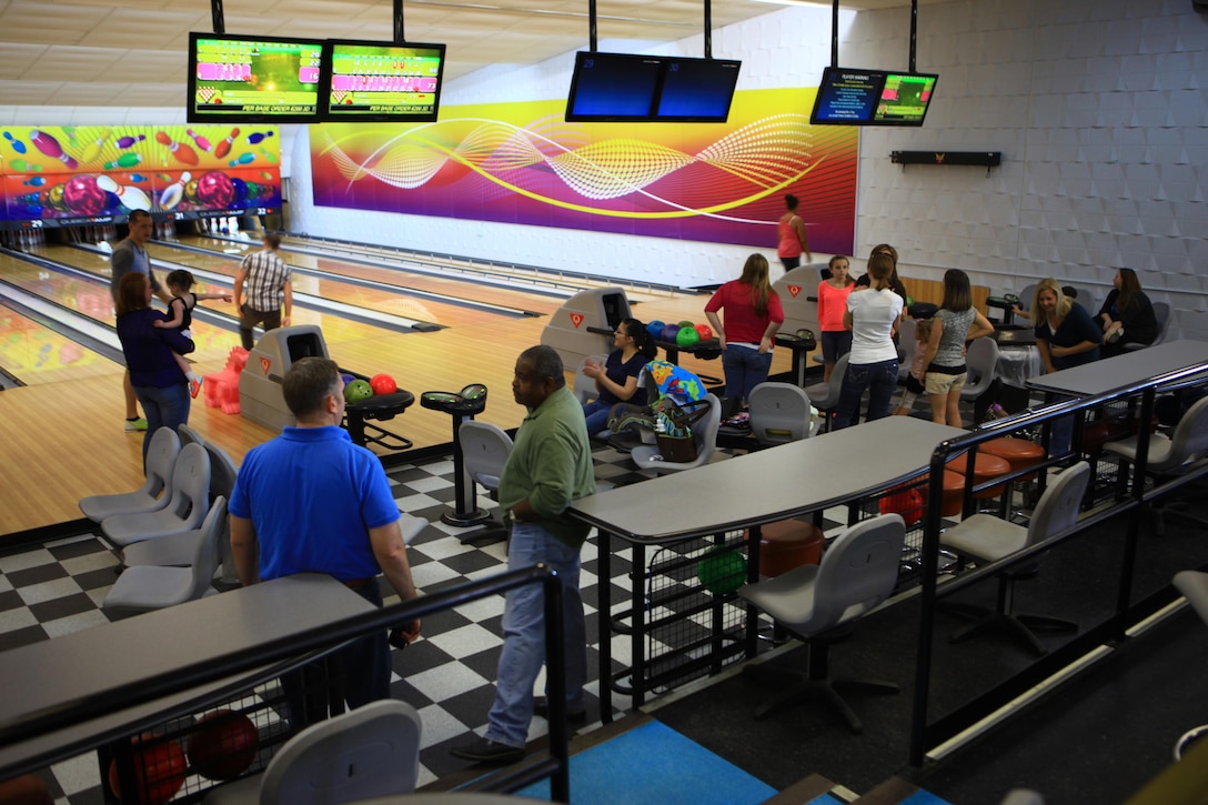Marines and families with Combat Logistics Battalion 22, Combat Logistics Regiment 27, 2nd Marine Logistics Group socialize during an event at the Bonnyman Bowling Center aboard Camp Lejeune, N.C., March 16, 2013. Servicemembers and their families enjoyed pizza, beverages and multiple rounds of bowling as they established friendships. 