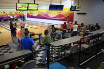 Marines and families with Combat Logistics Battalion 22, Combat Logistics Regiment 27, 2nd Marine Logistics Group socialize during an event at the Bonnyman Bowling Center aboard Camp Lejeune, N.C., March 16, 2013. Servicemembers and their families enjoyed pizza, beverages and multiple rounds of bowling as they established friendships. 