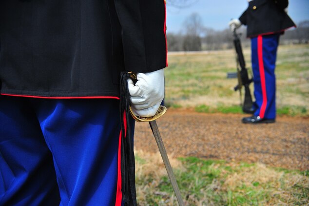 A Marine stands at parade rest clutching a noncommissioned officer sword adorned with a mourning knot in honor of the 262nd anniversary of former president James Madison's birth on March 16, 2013. Madison, the fourth president of the United States, is known as the Father of the Constitution, because of his pivotal role in the document's drafting.