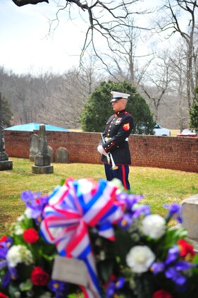 Cpl. Jonathan Staples, a trumpet player for the Quantico Marine Band, stands with hands interlaced during the official wreath-laying ceremony in honor of the 262nd anniversary of former president James Madison's birth on March 16, 2013. Madison, the fourth president of the United States, is known as the Father of the Constitution, because of his pivotal role in the document's drafting.