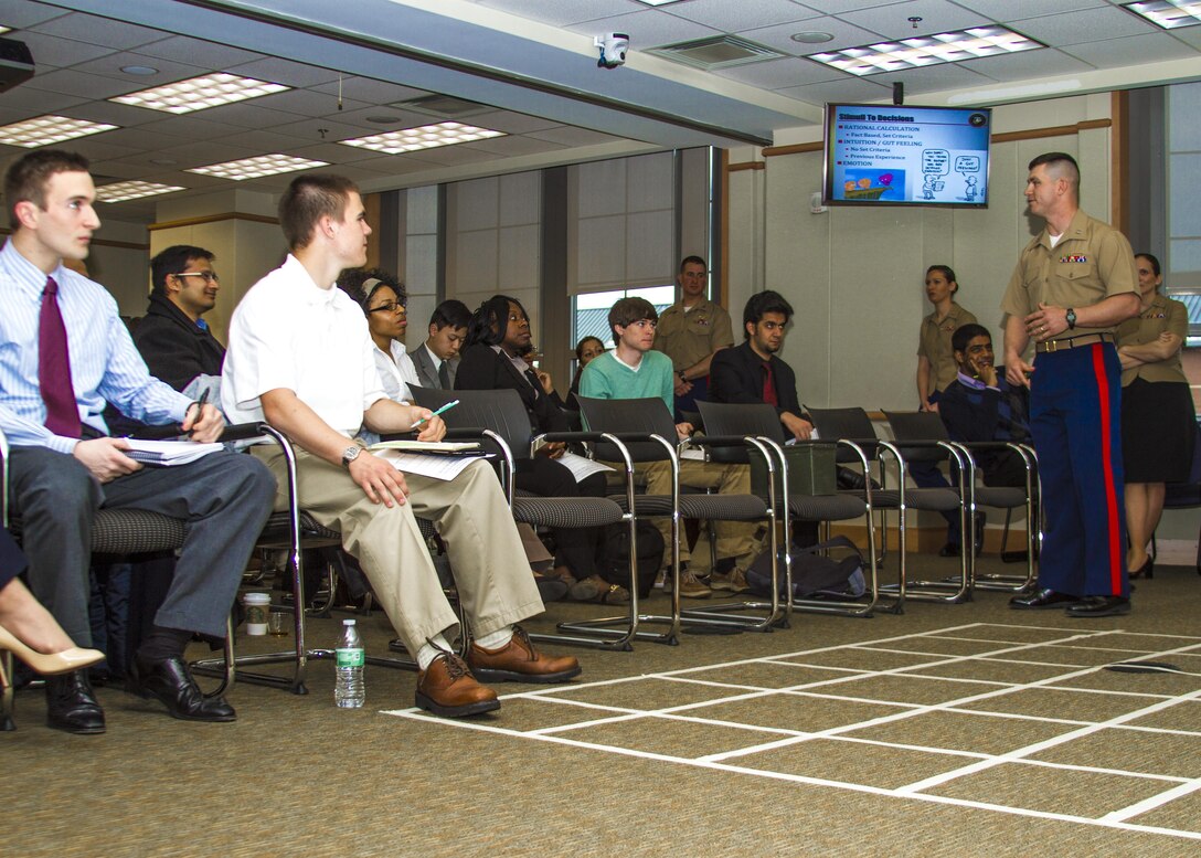 Captain Michael R. Schulz, an academic instructor and Officer Candidate School at Marine Corps Base Quantico, Va., leads Virginia Commonwealth University students through a class on leadership decisions during the Marine Corps Leadership Seminar, Mar. 15. 