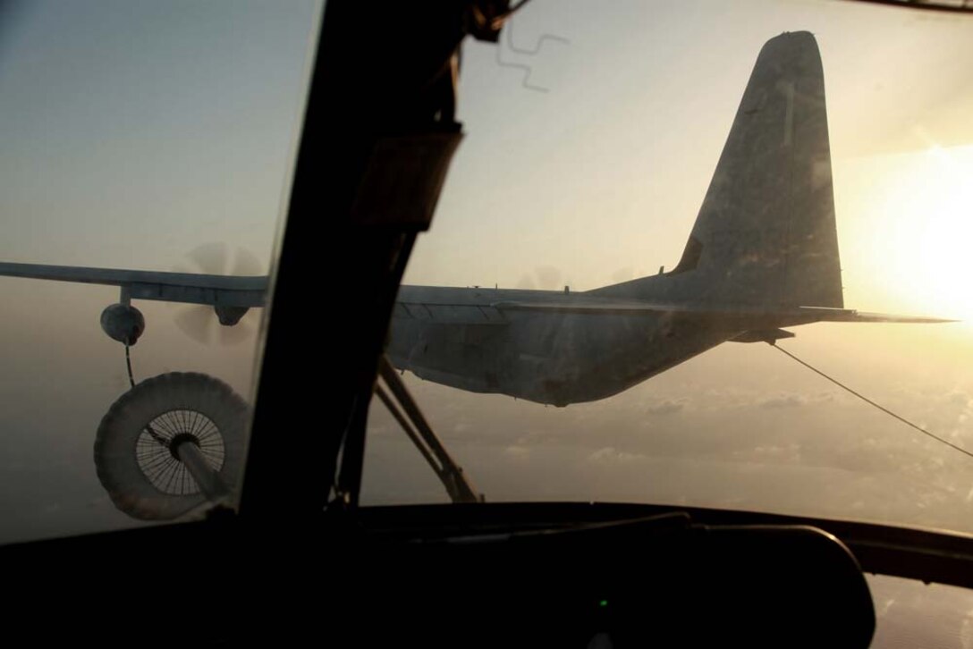 A KC-130 Hercules with Marine Medium Helicopter Squadron 364 (Rein.), 15th Marine Expeditionary Unit, refuels a CH-53E Super Stallion in the U.S. 5th Fleet area of responsibility, March 14. The 15th MEU is deployed as part of the Peleliu Amphibious Ready Group as a U.S. Central Command theater reserve force, providing support for maritime security operations and theater security cooperation efforts in the U.S. 5th Fleet area of responsibility. (U.S. Marine Corps photo by Cpl. John Robbart III)