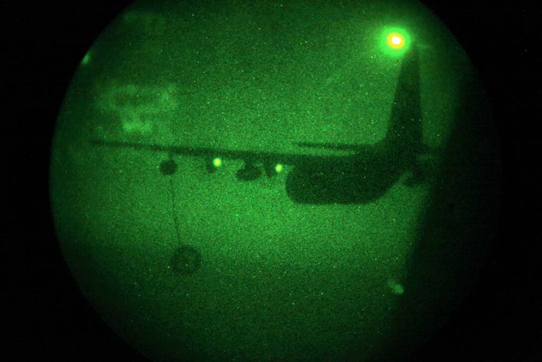 A KC-130 Hercules with Marine Medium Helicopter Squadron 364 (Rein.), 15th Marine Expeditionary Unit, flies away after refueling a CH-53E Super Stallion in the U.S. 5th Fleet area of responsibility, March 14. The 15th MEU is deployed as part of the Peleliu Amphibious Ready Group as a U.S. Central Command theater reserve force, providing support for maritime security operations and theater security cooperation efforts in the U.S. 5th Fleet area of responsibility. (U.S. Marine Corps photo by Cpl. John Robbart III)