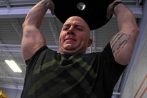 Gunnery Sgt. Nate McIntosh pushes through a CrossFit exercise with Marines from Recruiting Station Twin Cities March 18. McIntosh was one of 20 Marines who attended the three-day fitness engagement. 