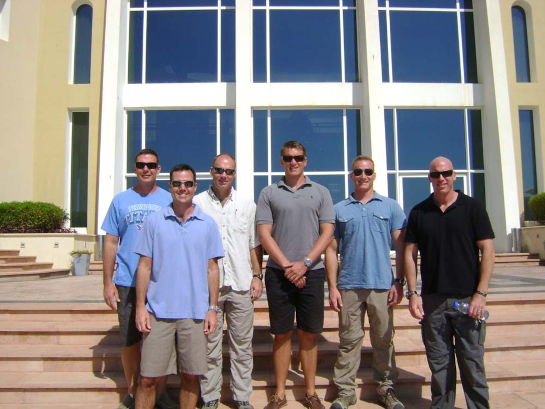 Major Benajmin Watson (center), assistant operations officer, 15th Marine Expeditionary Unit, stands with other staff members from the 15th MEU.  Watson is part of an exchange program enabling him to serve in a Marine Corps unit for two years. The intent of the exchange program is to help build maturity in Australiaâ€™s amphibious program by providing maritime operational planning experience to its officers.  The 15th MEU is deployed as part of the Peleliu ARG as a U.S. Central Command theater reserve force, providing support for maritime security operations and theater security cooperation efforts in the U.S. 5th Fleet area of responsibility. (Courtesy photo, Undated)