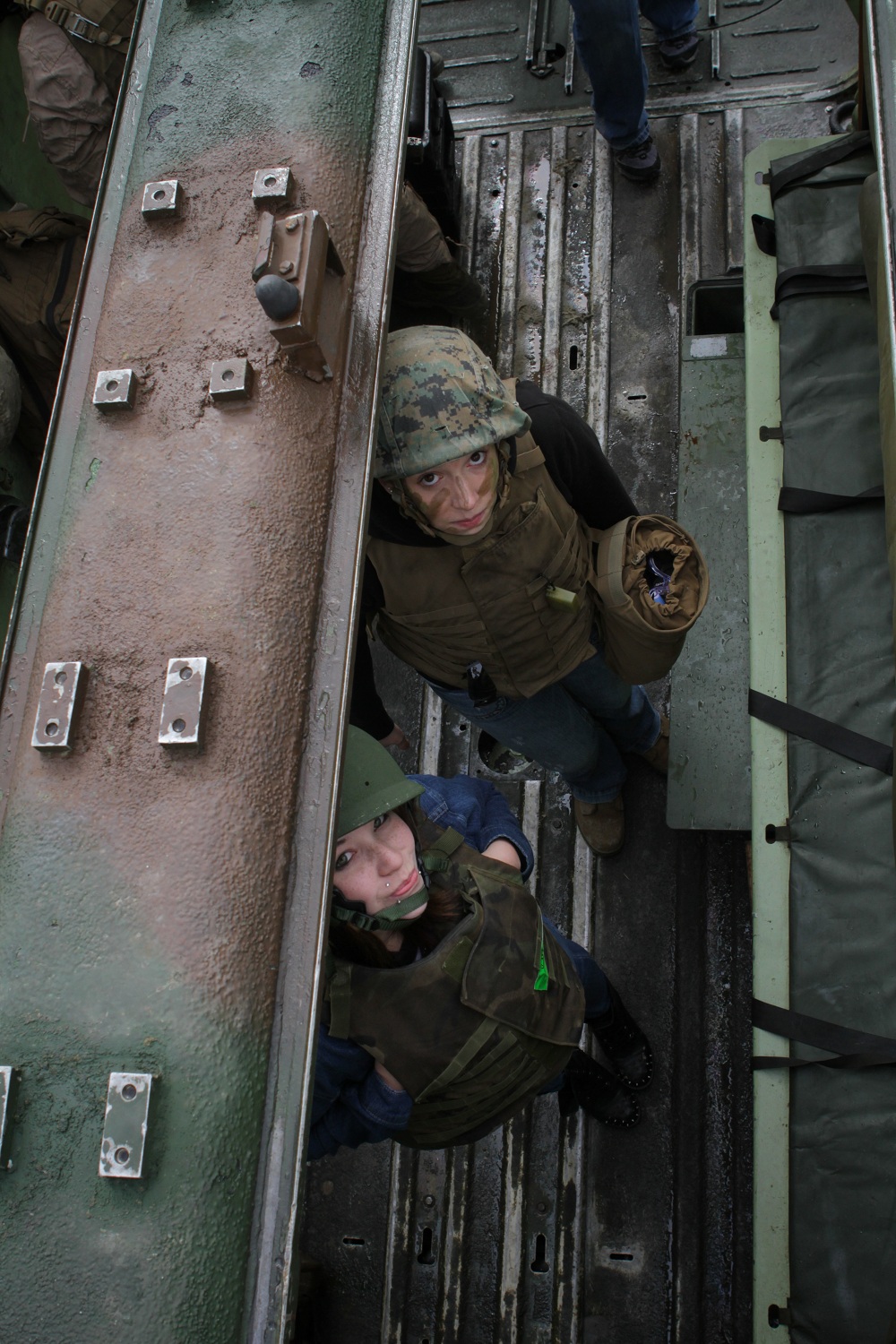 Ashley Hopkins, a native of St. Louis and the wife of Cpl. Joshua Hopkins of Headquarters and Service Company, 3rd Assault Amphibian Battalion, and Sierra Bishop, a native of Oceanside, Calif., and the daughter of Master Gunnery Sgt. Gregory Bishop of 3rd AABn, file into an amphibious assault vehicle just before riding down Camp Pendleton’s Red Beach during the battalion’s Jane Wayne Day here, March 15, 2013. Jane Wayne Day provides spouses and family members of Marines and sailors with the opportunity to get a taste of Marine Corps training and experience a day in the life of a Marine with 3rd AABn. In addition to riding in AAVs, family members participated in Marine Corps Martial Arts Program training, and received instruction on several Marine Corps weapon systems.