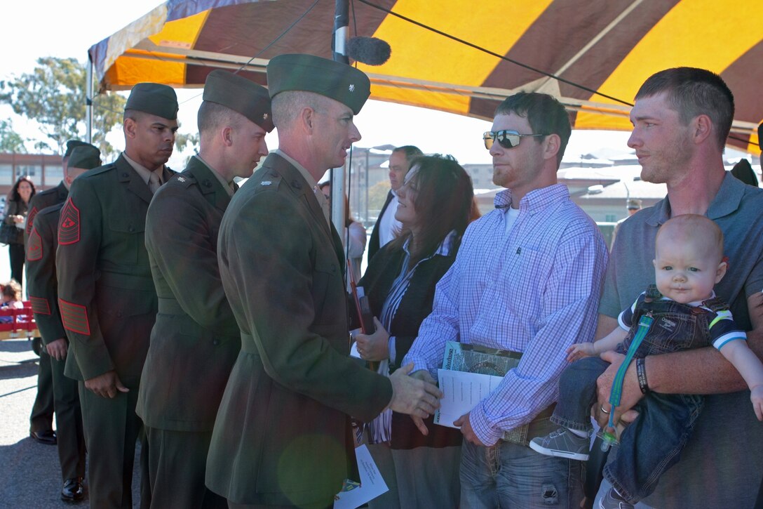 Lieutenant Colonel Jason Perry, the former commanding officer of 2nd Battalion, 5th Marine Regiment, shakes the hand of Chad Wilson after his brother, Sgt. Wade Wilson, was posthumously awarded the Silver Star Medal during a ceremony here, March 14, 2013. Wilson, a native of Centerville, Texas, received the nation's third highest decoration for valor for putting himself in between insurgent fire and a wounded Marine while serving in Musa Qa'leh district, Helmand province, Afghanistan on May 11, 2012. Wilson sustained multiple gunshot wounds and was mortally wounded while advancing toward the insurgent, who fled and was killed by his fellow Marines.