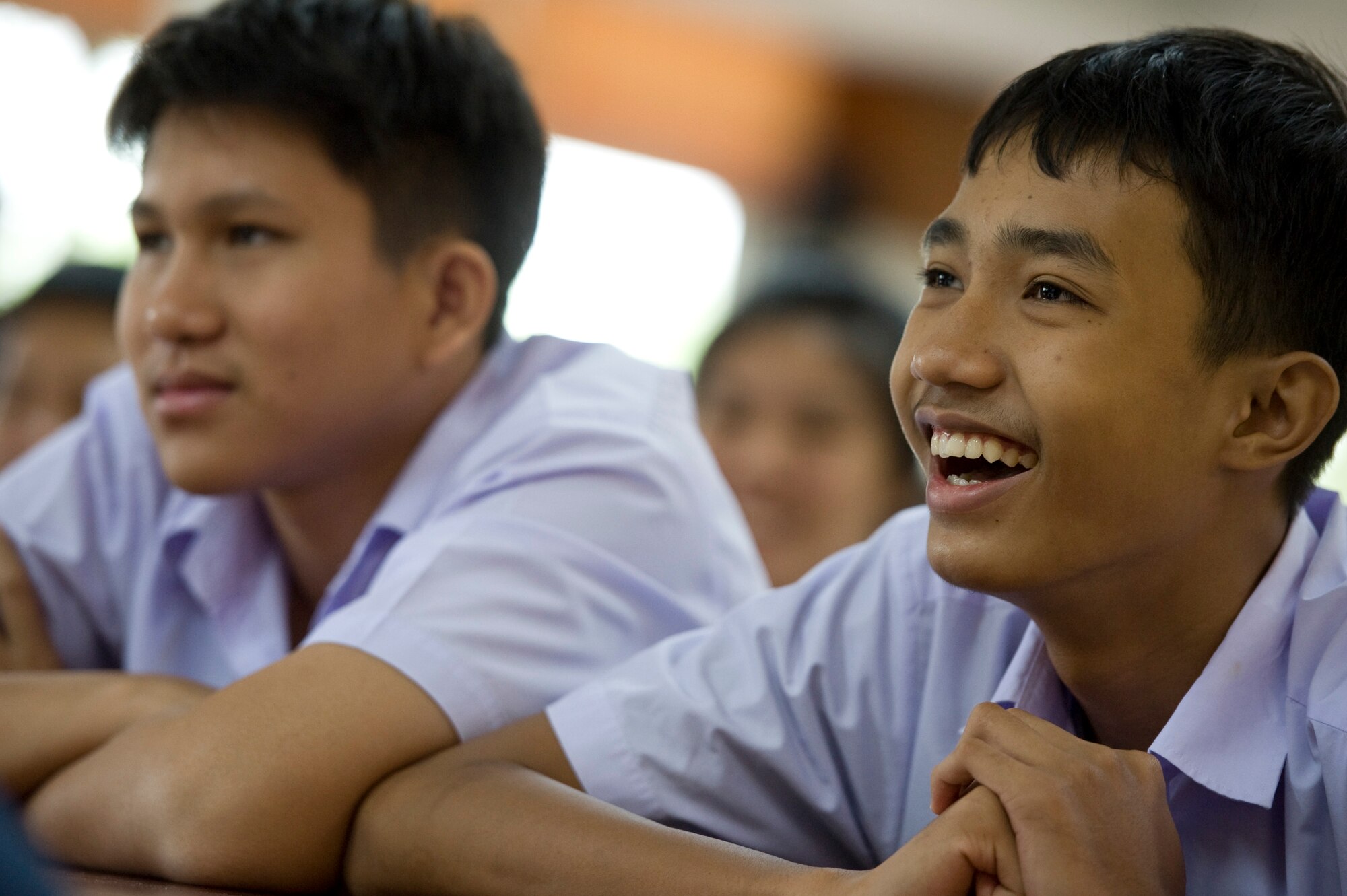 Students meet Airmen from the U.S. Air Force, Thai Royal Air Force and Republic of SIngapore Air Force at Korat Pittyakom School during Cope Tiger 13 in Nakhon Ratchasima, Thailand, March 18, 2013. Approximately 50 exercise pariticipants visited the school during a cultural exchange visit. More than 300 U.S. service members are participating in CT13, which offers an unparalleled opportunity to conduct a wide spectrum of large force employment air operations and strengthen military-to-military ties with two key partner nations, Thailand and Singapore. (U.S. Air Force photo/2nd Lt. Jake Bailey)