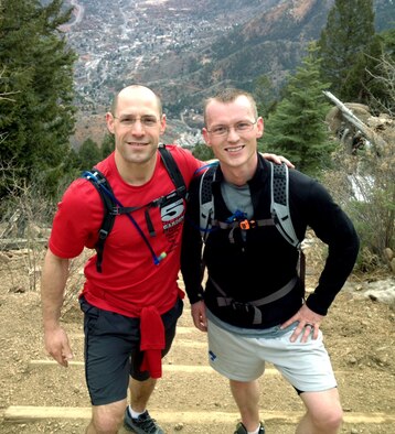 Maj. Tom Heier, left, and Capt. Ben Worker, right, pose at the top of the 8,590 ft. Manitou Incline March 16, 2013. The two Air Force Academy instructors received Commendation Medals March 18 for their efforts to save the life of a fellow hiker Jan. 26. (U.S. Air Force photo)