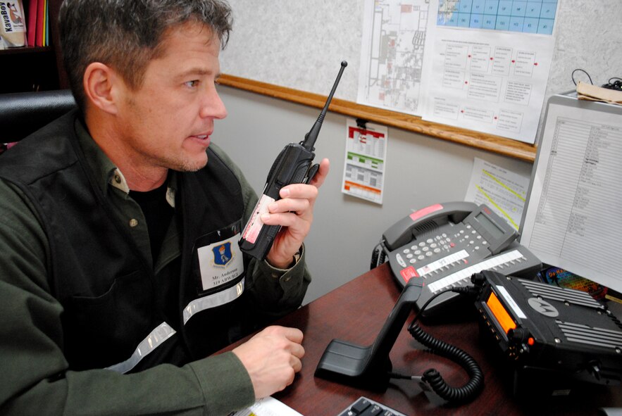 Chad Anderson, Grand Forks Air Force Base Inspector General chief of exercise inspections, relays a radio message to start another mock scenario during an readiness exercise which took place on March 15, 2013, on Grand Forks AFB, N.D. Before becoming a civil servant, Anderson competed eight years of service in the Air Force. (U.S. Air Force photo/Senior Airman Luis Loza Gutierrez)