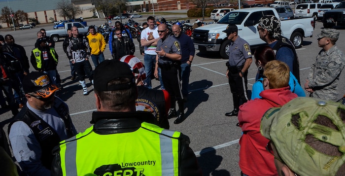 Two deputy sheriffs from the Charleston County Sheriff’s Office brief motorcyclists from Joint Base Charleston about motorcycle safety March 15, 2013, at the North Charleston Coliseum. More than 200 Airmen, Sailors, Soldiers, civilians and dependents from JB Charleston participated in the 2013 Joint Base Charleston Motorcycle Safety Rodeo throughout the Lowcountry. The event provided motorcyclists with information about safe riding, motorcycle laws in South Carolina, military regulations and proper riding equipment. (U.S. Air Force photo/Airman 1st Class Jared Trimarchi)
