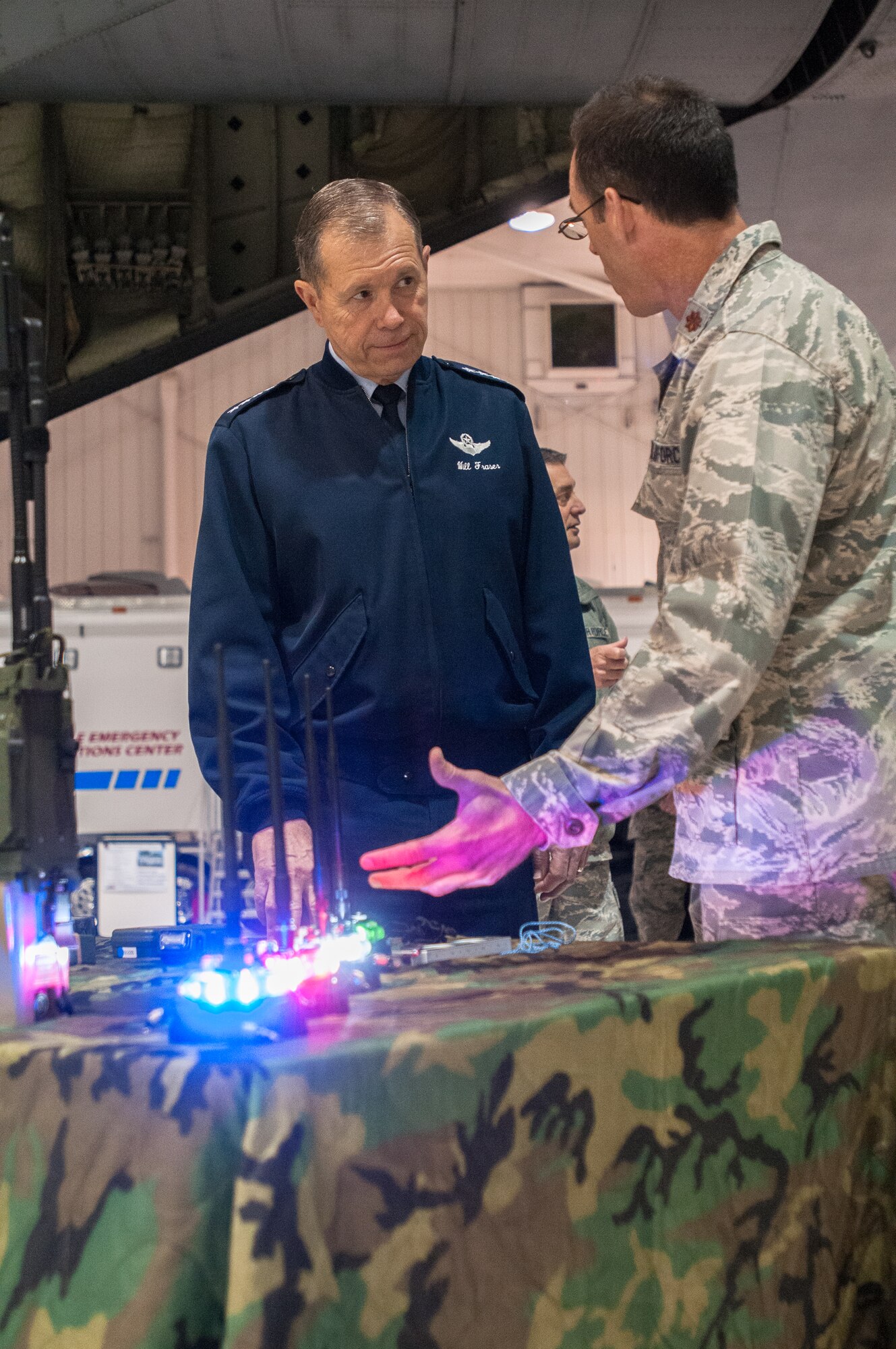 Maj. Sean McLane, director of operations for the Kentucky Air National Guard’s 123rd Special Tactics Squadron, demonstrates a variety of special operations equipment to General William M. Fraser III, commander of U.S. Transportation Command, during a tour of the 123rd Airlift Wing in Louisville, Ky., on March 12, 2013. The gear is used to establish operations at austere landing zones. (U.S. Air Force Photo by Master Sgt. Phil Speck)