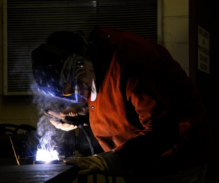 Staff Sgt. Davis McClain, 2nd Logistics Readiness Squadron Allied Trades section, welds metal on Barksdale Air Force Base, La., March 19. The allied trade shop's main responsibilities include tire repair and replacement and body work for Barksdale's fleet of vehicles ranging from fire trucks, maintenance and government owned vehicles. (U.S. Air Force photo/Airman 1st Class Andrew Moua)