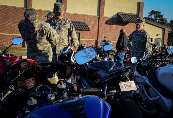 Colonel Richard McComb, Joint Base Charleston commander, Col. Albert Miller, 437th Airlift Wing vice commander, and Chief Master Sgt. Earl Hannon, 628th Air Base Wing command chief, vote for the nicest looking bikes during the 2013 Joint Base Charleston Motorcycle Safety Rodeo March 15, 2013, at Joint Base Charleston – Air Base. The four categories were best custom bike, best sports bike, best cruiser and commander’s choice for best bike. More than 200 Airmen, Sailors, Soldiers, civilians and dependents from JB Charleston participated in the event. (U.S. Air Force photo/Airman 1st Class Jared Trimarchi)