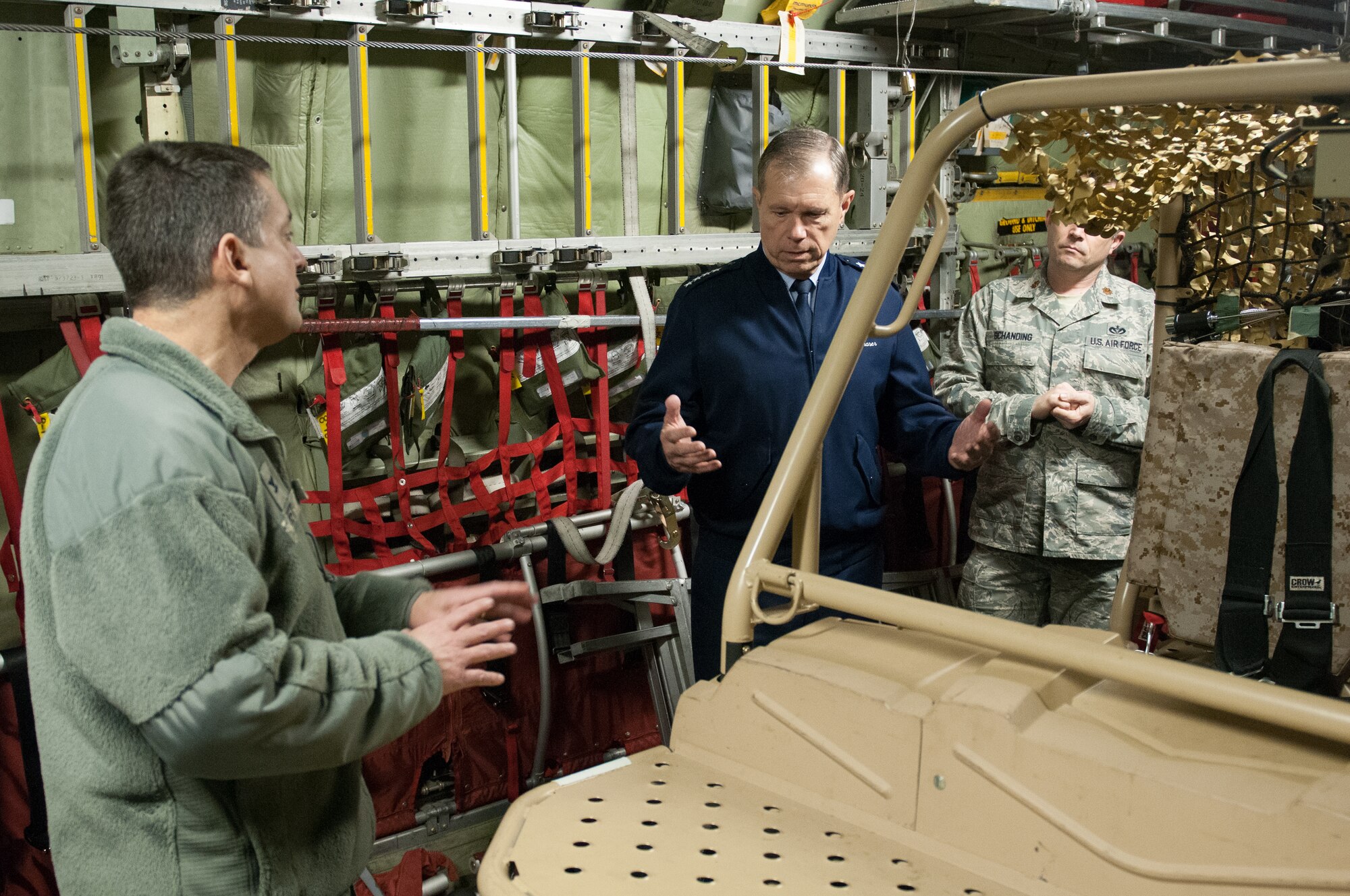Col. Warren Hurst (left), commander of the 123rd Airlift Wing, discusses with Gen. William M. Fraser III, commander of U.S. Transportation Command, how the wing’s C-130s are loaded with specialized gear for disaster-response operations. Fraser was visiting the Kentucky Air National Guard Base in Louisville, Ky., on March 12, 2013, to learn more about the 123rd Airlift Wing. (U.S. Air Force Photo by Master Sgt. Phil Speck)