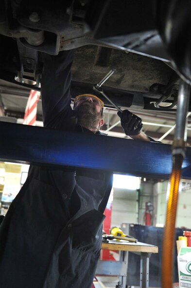 Frank Judkins, 509th Force Support Squadron Spirit Auto automotive technician, performs maintenance on a customer’s vehicle during his shift at Whiteman Air Force Base, Mo., March 12, 2013. Customers can make an appointment to have their car repaired or can work on their own vehicles. (U.S. Air Force photo by Heidi Hunt/Released)
