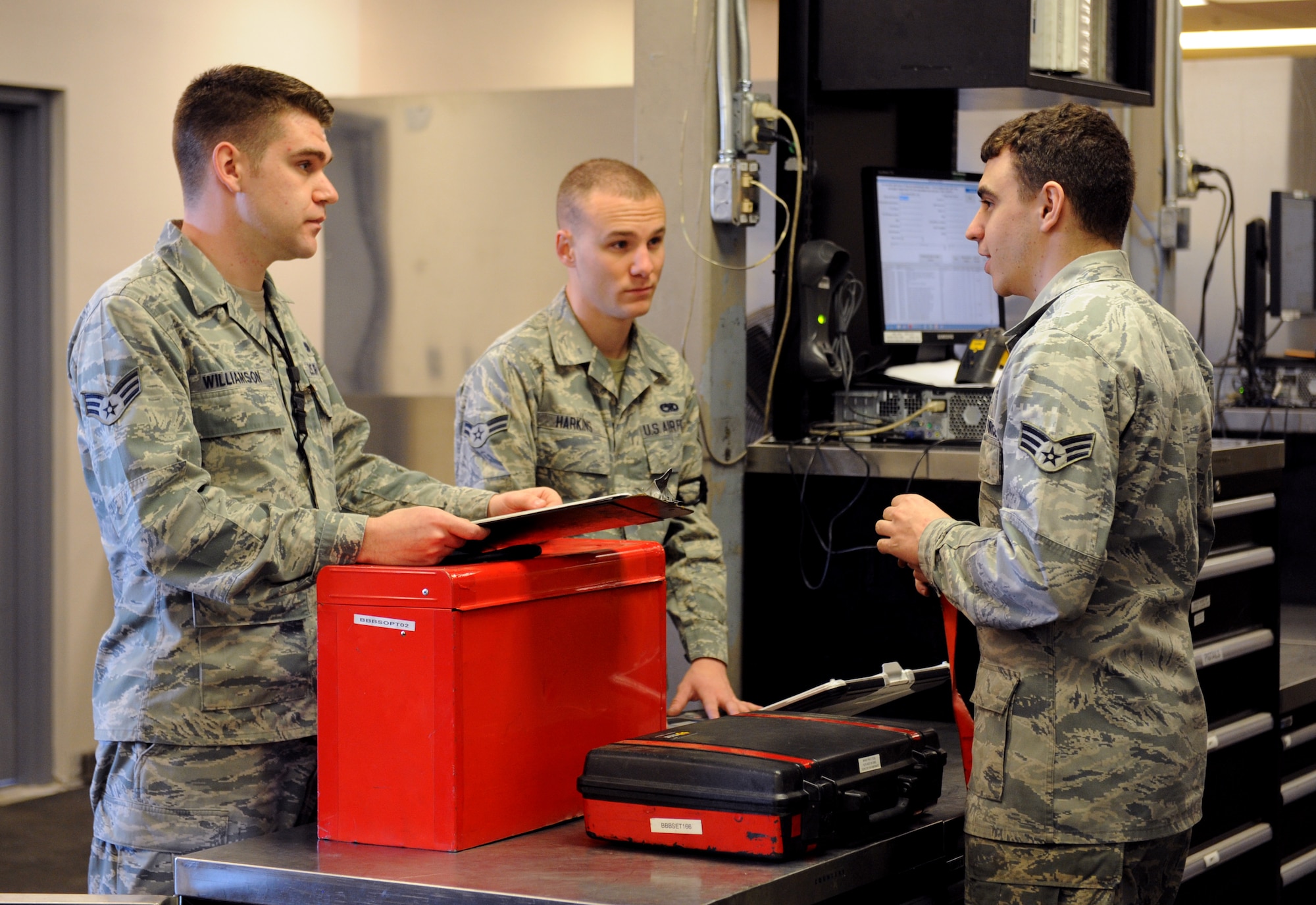 Senior Airman Cody Moore, 2nd Aircraft Maintenance Squadron Support Section, speaks with maintenance Airmen before issuing equipment on Barksdale Air Force Base, La., March 19. Most equipment used by maintenance Airmen is checked out and turned in at 2 AMXS Support Section. The 2 AMXS support section maintains 24-hour coverage and consists of three shifts that each work nine-hour days. When a new shift comes in, they take inventory of all the equipment as it is returned. (U.S. Air Force photo/Airman 1st Class Benjamin Gonsier)