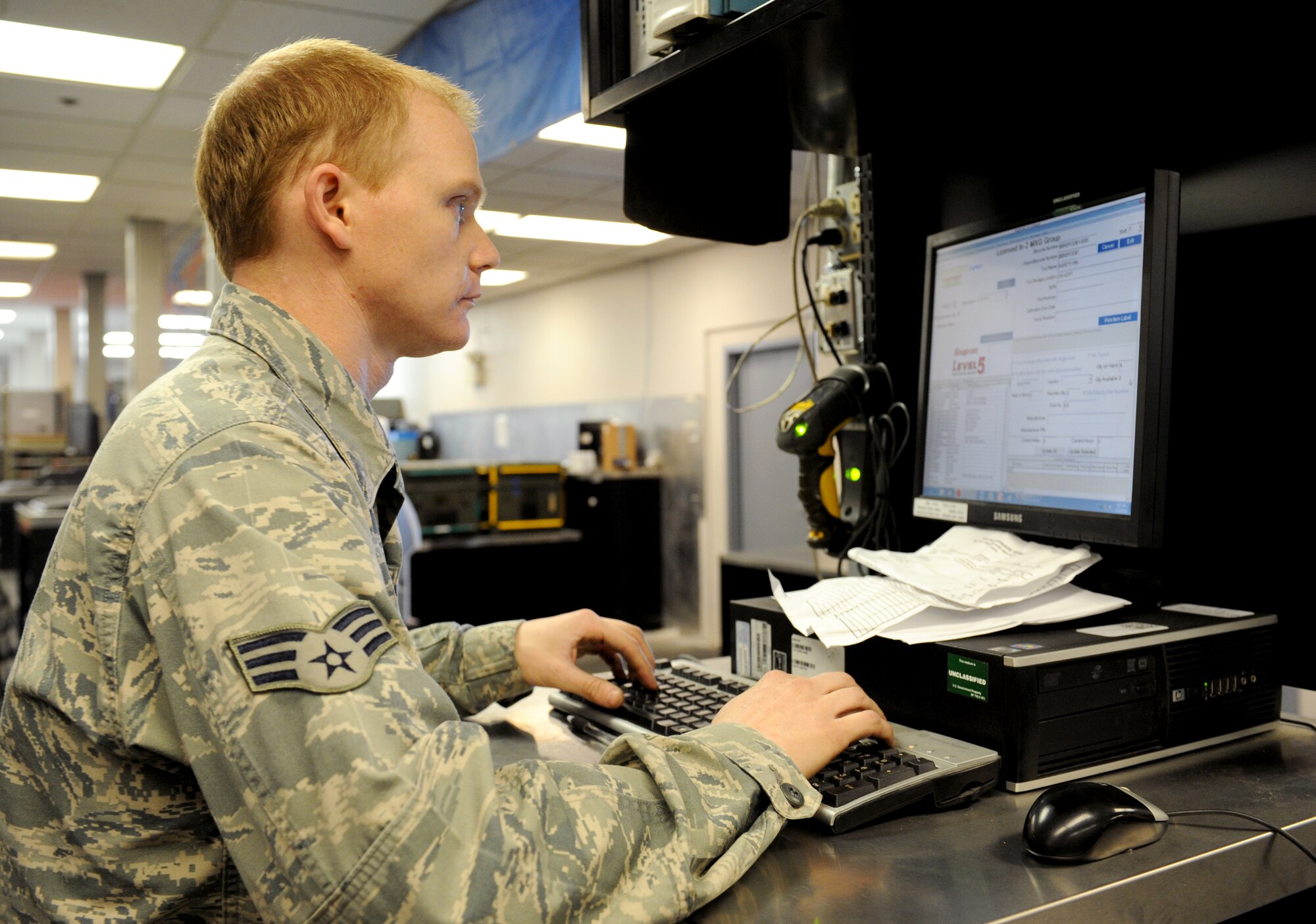 Senior Airman Scott Foss, 2nd Aircraft Maintenance Squadron Support Section, inventories an item using TCmaxx on Barksdale Air Force Base, La., March 19. Airmen in the support section use TCMaxx to keep track of all of the equipment in storage and in use by maintenance Airmen. (U.S. Air Force photo/Airman 1st Class Benjamin Gonsier)
