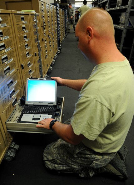 Tech. Sgt. Charles Marting, 2nd Aircraft Maintenance Squadron Support Section, turns on a laptop at Barksdale Air Force Base, La., March 19. Marting checked the sync date for the laptops, which can not be more than seven days out of date. The 2 AMXS support section distributes, receives, inventories and inspects the equipment used to maintain the B-52H Stratofortress and is responsible for more than 21,000 tools valued at $15 million. (U.S. Air Force photo/Airman 1st Class Benjamin Gonsier) 
