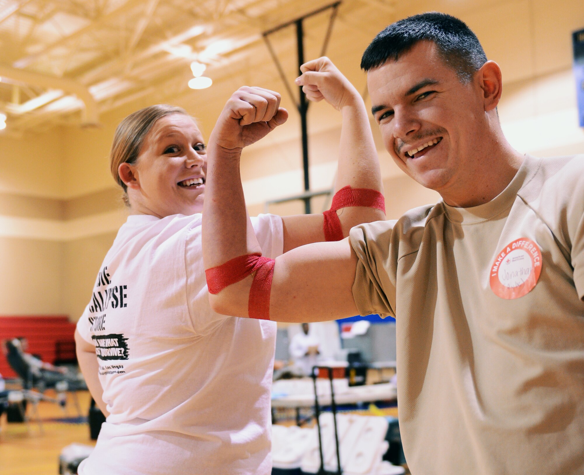 Ashley Gabel, wife of U.S. Air Force Staff Sgt. William Gabel, 20th Component Maintenance Squadron electronic warfare systems team member, and Airman 1st Class Jonathan Thomas, 20th Communications Squadron airfield systems technician, pose for a photo after donating to the American Red Cross blood drive at the fitness center, Shaw Air Force Base, S.C.,  March 14, 2013. Shaw's American Red Cross holds quarterly blood drives each year. (U.S. Air Force photo by Senior Airman Tabatha Zarrella/Released)
