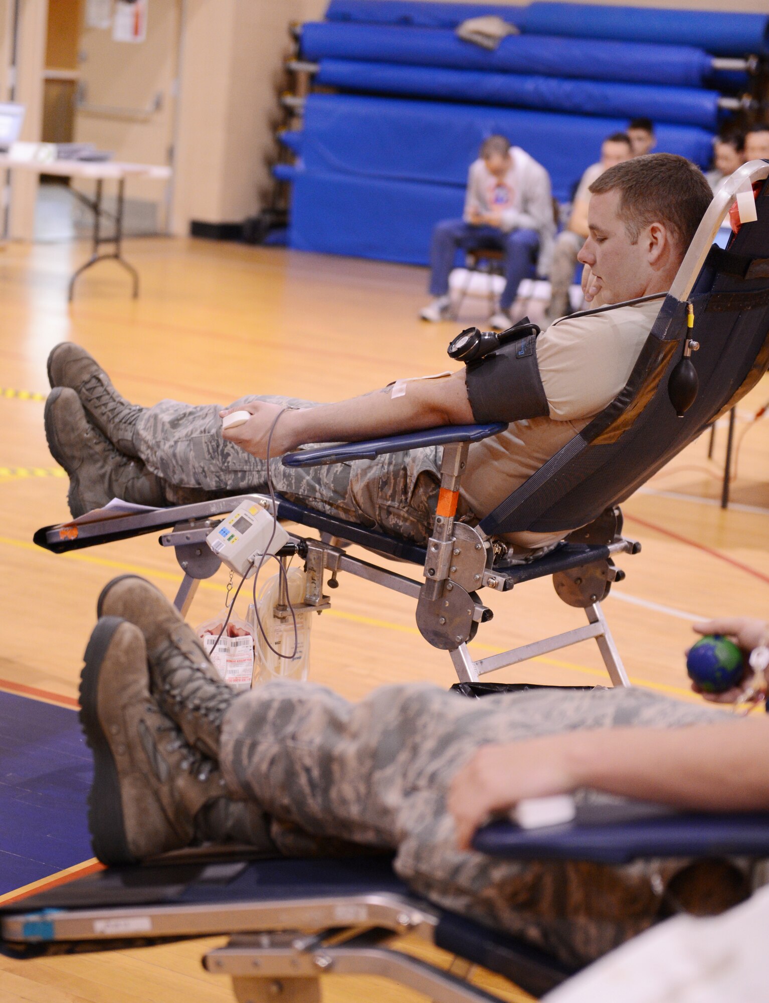 Team Shaw members sit in a reclining chair while getting their blood drawn, which usually takes about eight to ten minutes at the fitness center, Shaw Air Force Base S.C., March 14, 2013. Shaw's American Red Cross holds quarterly blood drives each year. (U.S. Air Force photo by Senior Airman Tabatha Zarrella/Released)
