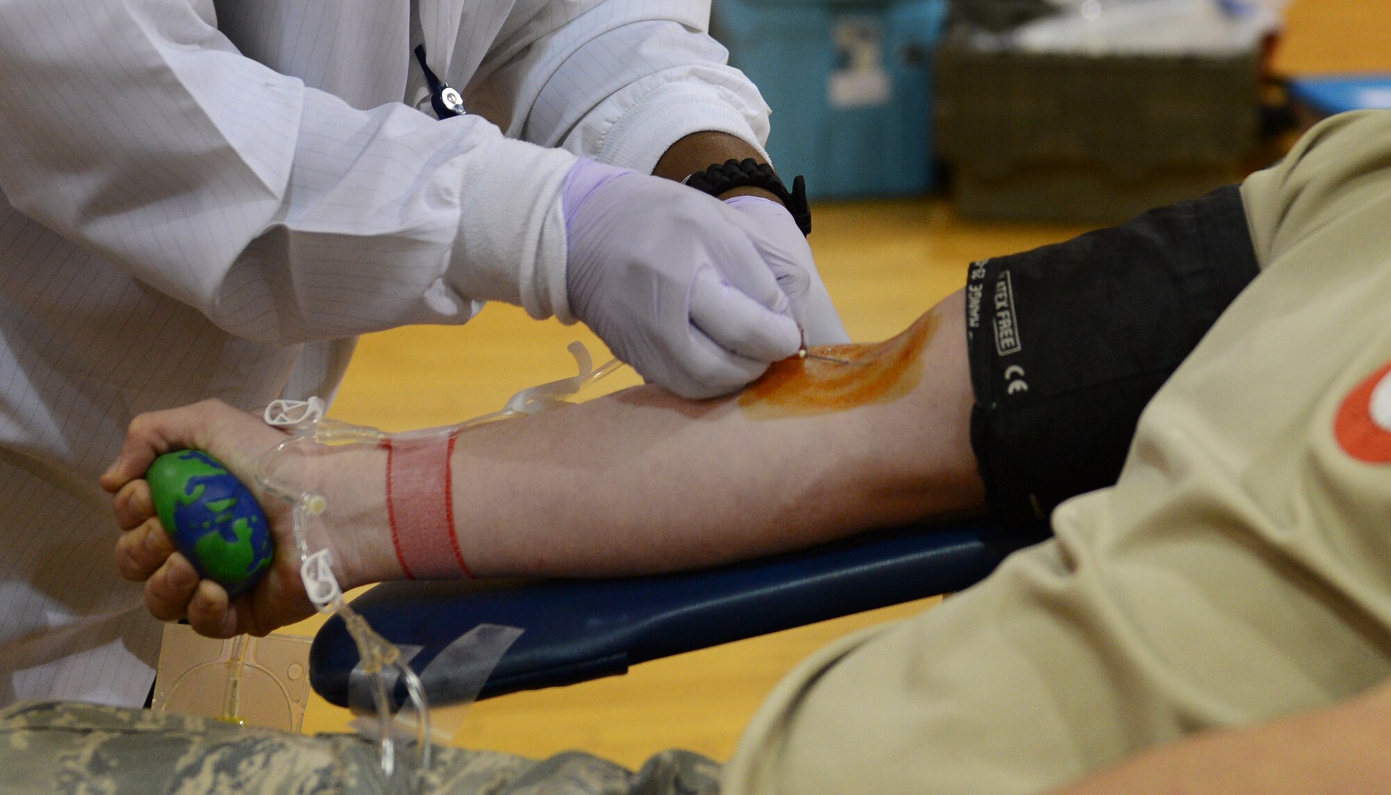 U.S. Air Force Airman 1st Class Jonathan Thomas, 20th Communications Squadron airfield systems technician, begins getting his blood drawn at the fitness center, Shaw Air Force Base, S.C., March 14, 2013. Shaw's American Red Cross holds quarterly blood drives each year. (U.S. Air Force photo by Senior Airman Tabatha Zarrella/Released)
