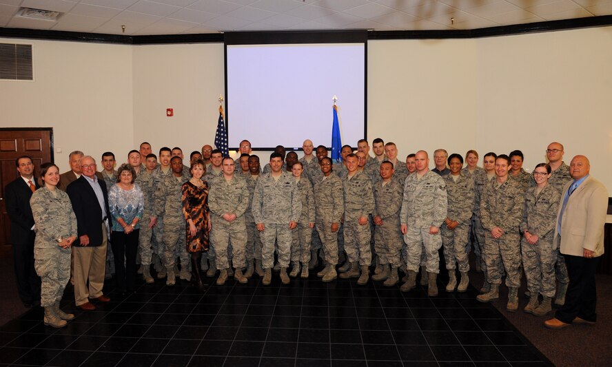 Barksdale Airmen and Operation Bright Holiday donors pose for a photo on Barksdale Air Force Base, La., March 19. More than 40 Airmen were sent home for the holidays thanks to members of the local community and the Company Grade Officers' Council. Operation Bright Holiday is an annual program and its goal is to raise funds to send Airmen home to spend the holidays with their families. (U.S. Air Force photo/Airman 1st Class Benjamin Gonsier)
