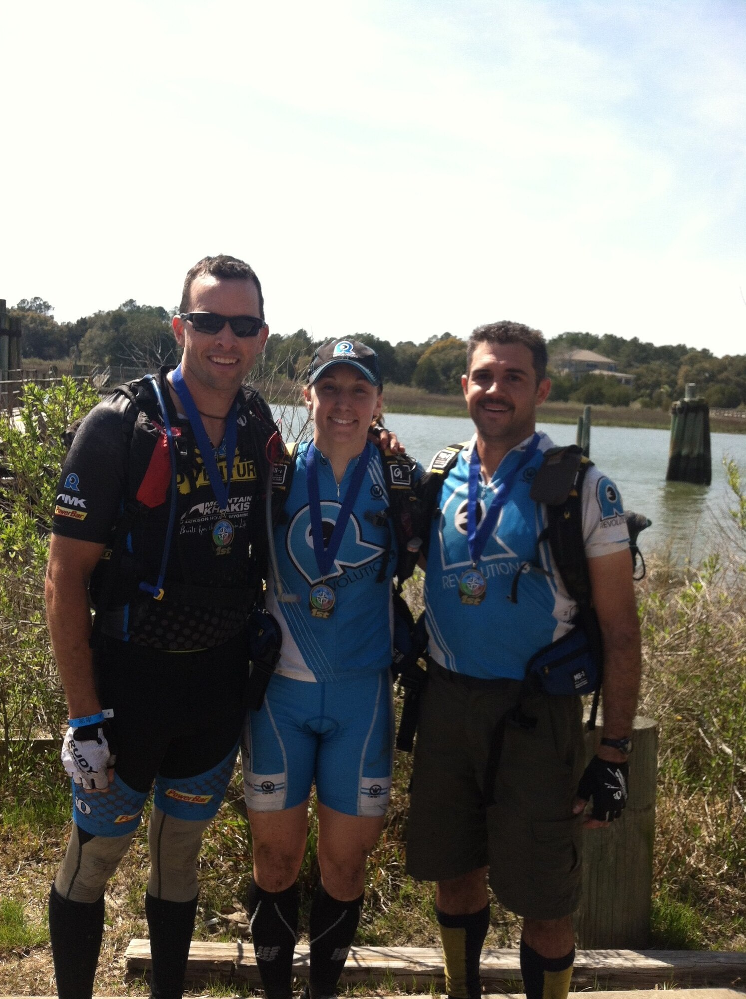 Lt. Col. David "Dash" Ashley, 5th Space Launch Squadron commander, and other members of the Rev3/Mountain Khakis Adventure Racing Team Britt Mason and Maj. Greg Voelkel, pose with the medals they received after winning the more-than-100-kilometer Swamp Fox Adventure Race March 16 in McClellansville, S.C. The team is currently ranked first in both the United States Adventure Racing Association and North American Adventure Racing Series annual points ranking for 2013.