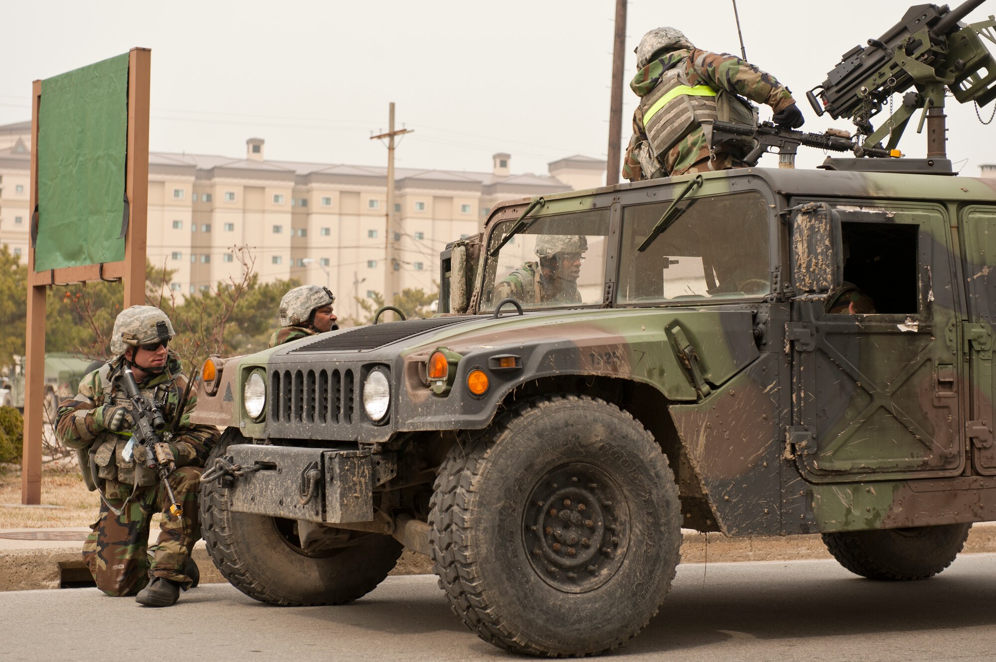 8th Security Forces Squadron members respond to an incident during exercise Beverly Midnight 13-2 at Kunsan Air Base, Republic of Korea, March 19, 2013. The defenders noticed two injured personnel and stopped to provide aid, care and security. (U.S. Air Force photo by Staff Sgt. Jonathan Fowler/Released)