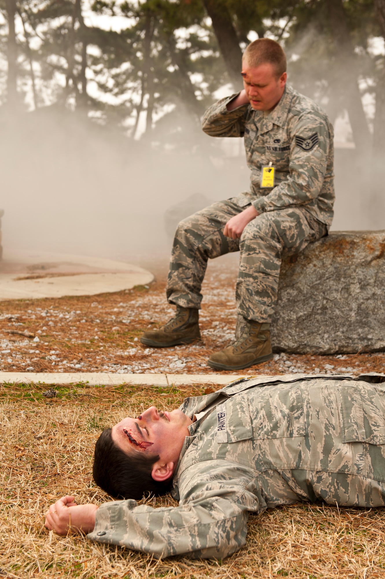 Staff Sgt. Michael O’Brien (top) and Senior Airman Ian Painter,  8th Fighter Wing role-players, simulate injuries during exercise Beverly Midnight 13-2 at Kunsan Air Base, Republic of Korea, March 19, 2013. 8th FW role-players are an integral part of Kunsan exercises and help make the scenarios realistic. (U.S. Air Force photo by Staff Sgt. Jonathan Fowler/Released)