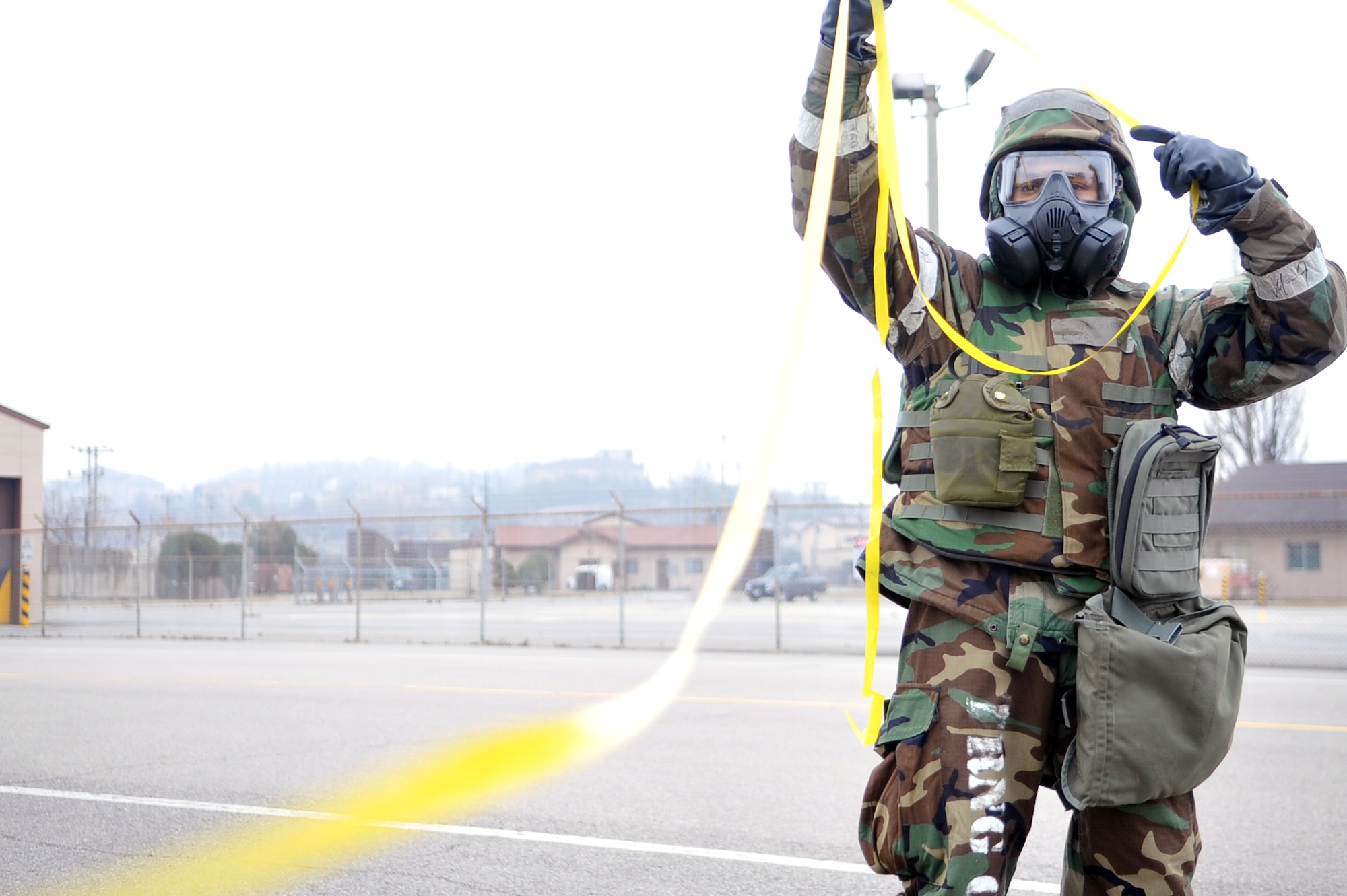 Staff Sgt. Daniel Garcia, 51st Civil Engineer Squadron Heating Ventilation and Air Conditioning journeyman, cordons off an area for a simulated large unexploded ordnance during Operation Readiness Exercise Beverly Midnight 13-02 at Osan Air Base, Republic of Korea, March 19, 2013.  The UXO was spotted while the Airmen were performing a post attack reconnaissance sweep. Osan Airmen are in the third simulated wartime contingency exercise executed in 2013 that will test the base's ability to defend and execute the mission in a heightened state of readiness. (U.S. Air Force photo/Senior Airman Alexis Siekert)