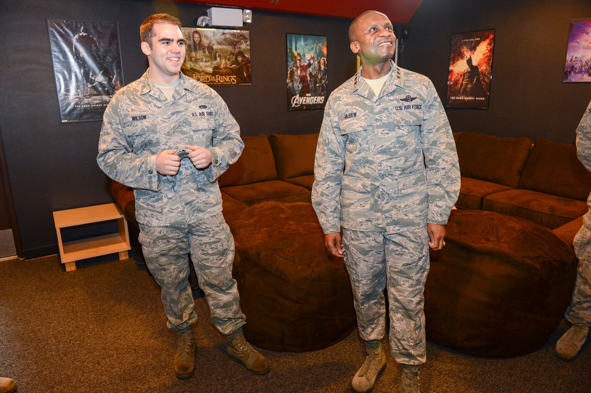 Airman 1st Class Rian Wilson, Better Opportunities for Single Service Members McChord Field lead representative, gives a tour of the newly-opened Mini Warrior Zone to Lt. Gen. Darren McDew, 18th Air Force commander, March 15, 2013 at Joint Base Lewis-McChord, Wash. Using funds donated by the JBLM BOSS program, Wilson and a team of volunteers renovated some of the common areas of the McChord Field dormitories, turning them into game and movie entertainment centers. (U.S. Air Force photo/Tech. Sgt. Sean Tobin)