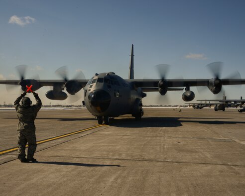 Master Sgt. Don Lundt, 133rd Aircraft Maintenance Squadron, marshals in Chief Master Sgt. Jim Ricci, 109th Airlift Squadron, last flight in St. Paul, Minn., Mar. 16, 2013. Ricci is retiring from the military after over 35 years of service. 
(U.S. Air Force photo by Staff Sgt. Amy M. Lovgren/Released)