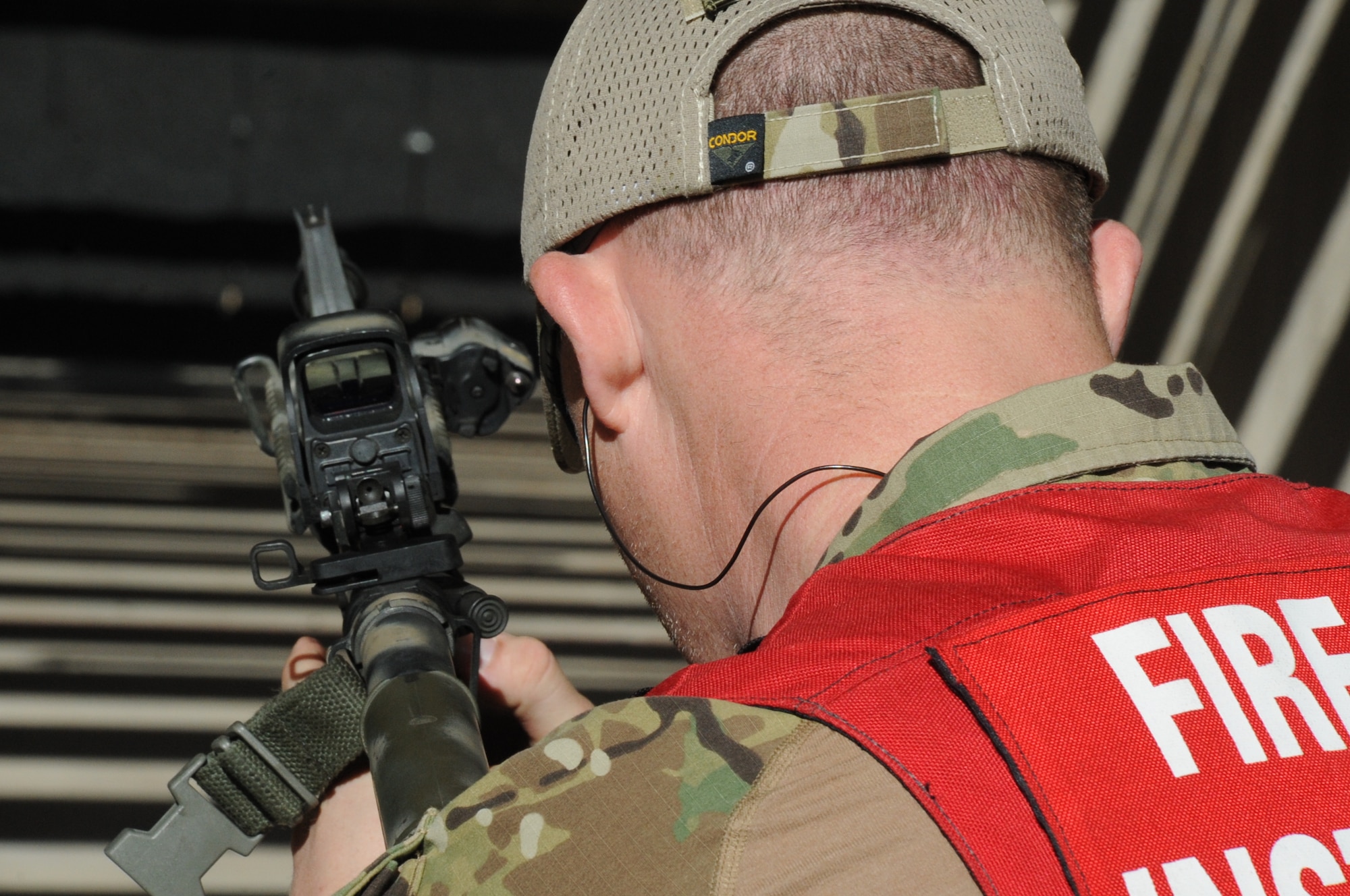 A firearms instructor with the Wichita Falls SWAT team conducts a rifle drill at a law enforcement shooting range March 14, 2013. The exercise was a part of a joint exercise with an Air Force Explosive Ordinance Disposal team from the 366th Training Squadron. (U.S. Air Force photo by Airman 1st Class Jelani Gibson)