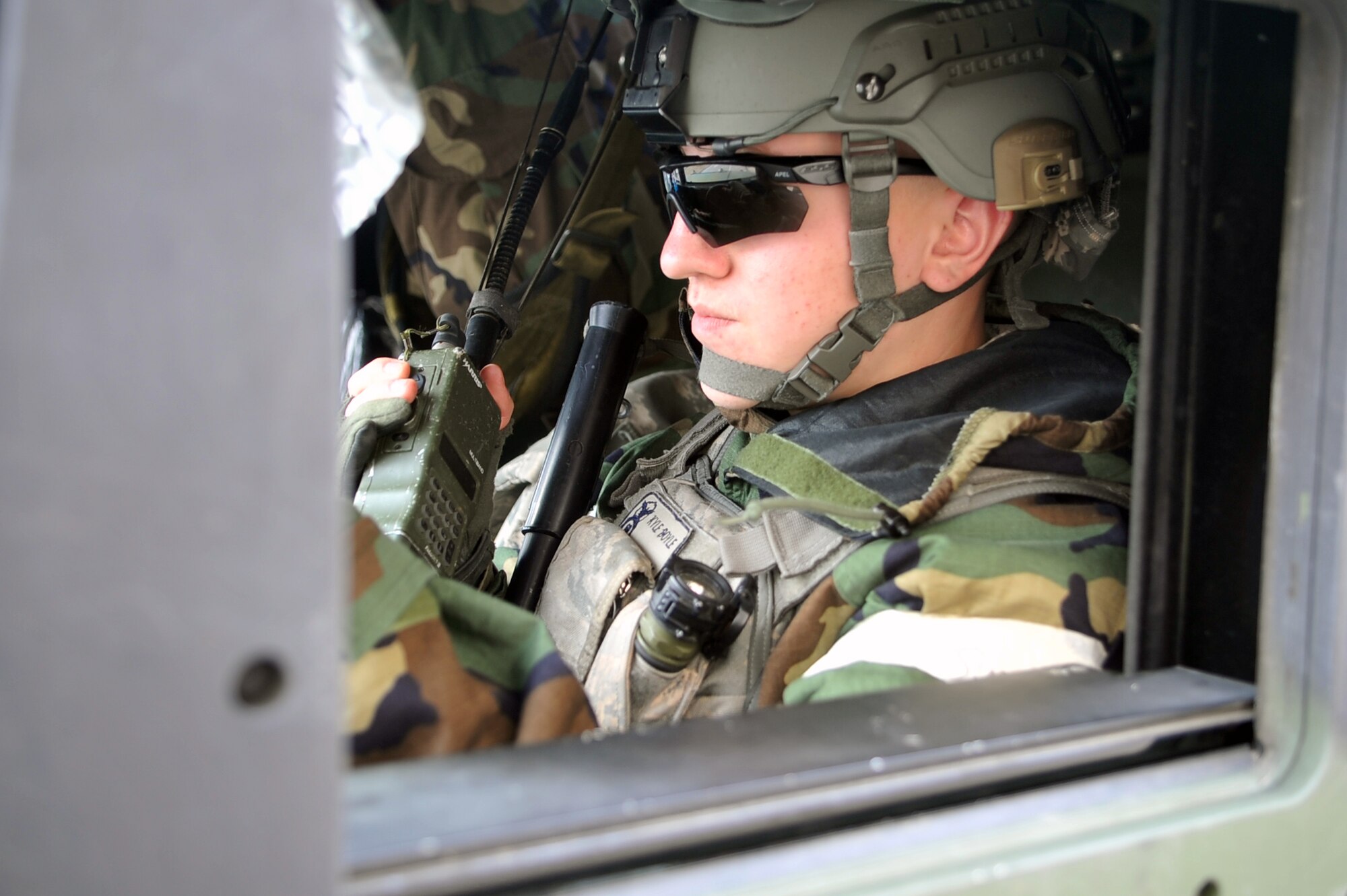Airman Kyle Boyle, 51st Security Forces defender, uses a radio to communicate his team’s status to a fellow SFS member during a training scenario to defend the base at Osan Air Base, Republic of Korea, March 19, 2013.  The training scenario was one of many during Operational Readiness Exercise Beverly Midnight 13-02 that help Airmen sharpen their skills in case of a real world contingency. (U.S. Air Force photo/Senior Airman Alexis Siekert)