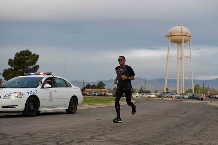 Brian Beachum, 757th Aircraft Maintenance Squadron crew chief, finishes first during the Shamrock 5-kilometer run organized by the Warrior Fitness Center March 15, 2013, at Nellis Air Force Base, Nev. Originally from Wichita, Kan., Beachum finished the run with a time of 17 minutes and 56 seconds. (U.S. Air Force photo by Airman 1st Class Christopher Tam)