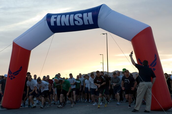 Runners get ready for the start of the Shamrock 5-kilometer run outside the Warrior Fitness Center March 15, 2013, at Nellis Air Force Base, Nev. The Warrior Fitness Center organizes 5-kilometer runs throughout the year to promote fitness and health. (U.S. Air Force photo by Airman 1st Class Christopher Tam)