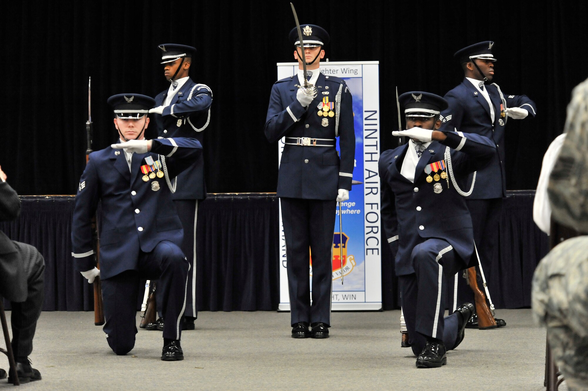 U.S. Air Force Honor Guard drill team members perform for Airmen during a Leadership Friday event, Shaw Air Force Base Community Activity Center, S.C., March 15, 2013. The drill team is the traveling component of the U.S. Air Force Honor Guard. Their mission is to promote the Air Force mission by showcasing drill performances at public and military venues to recruit, retain and inspire Airmen. The team performs drill movements with a fully-functional M-1 rifle in intricate, constantly changing formations. (U.S. Air Force photo by Senior Airman Amber E. N. Jacobs/Released)