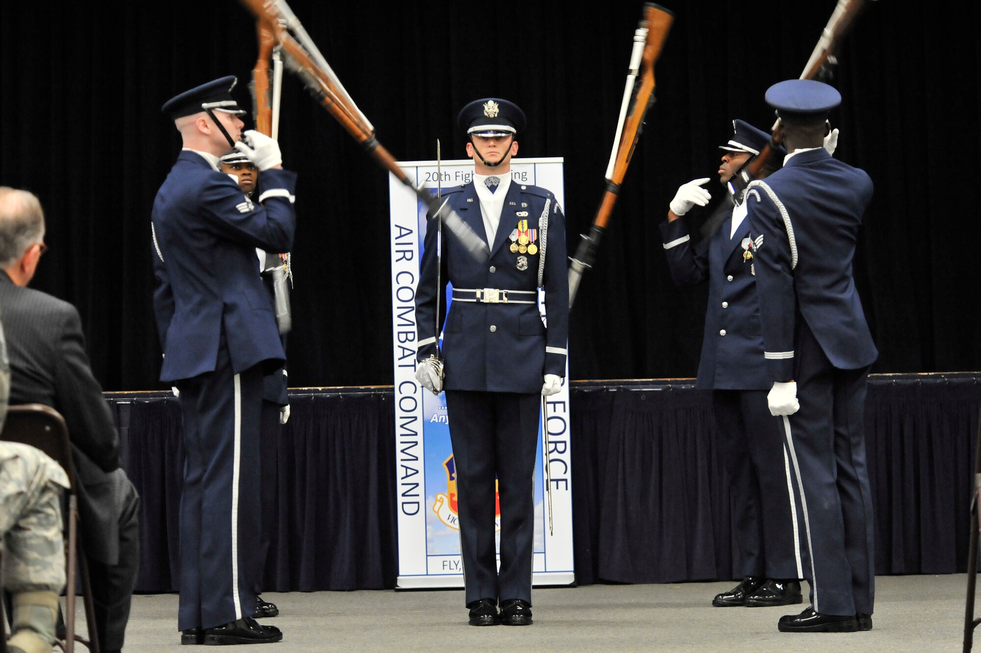 U.S. Air Force Honor Guard Drill Team members, perform during a Leadership Friday event, Shaw Air Force Base Community Activity Center, S.C., March 15, 2013. The vision of the USAF Honor Guard is to ensure a legacy of Airmen who promote the mission, protect the standards, perfect the image and preserve the heritage of the organization. (U.S. Air Force photo by Senior Airman Amber E. N. Jacobs/Released)