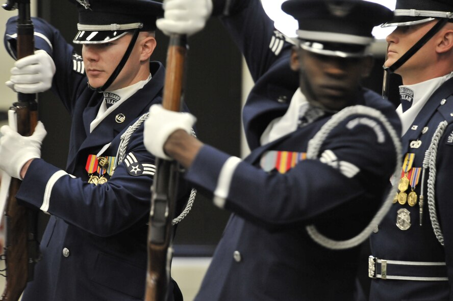 U.S. Air Force Honor Guard Drill Team members perform for Team Shaw during a Leadership Friday event, Shaw Air Force Base Community Activity Center, S.C., March 15, 2013. The honor guard visited Shaw in an effort to recruit new members. (U.S. Air Force photo by Senior Airman Amber E. N. Jacobs/Released)