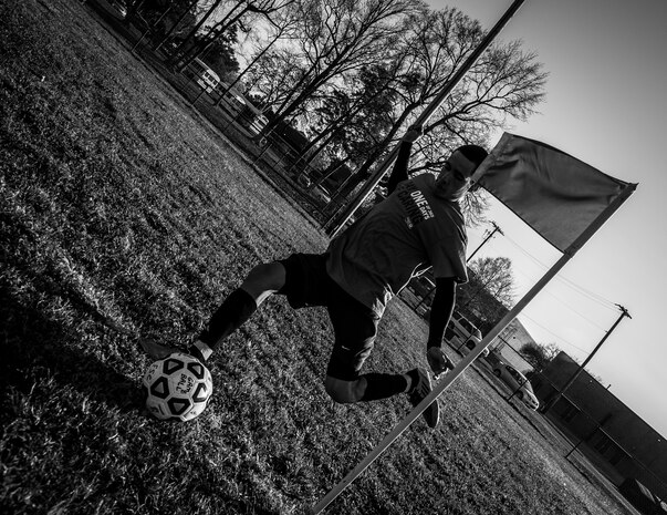 Frank Del Valle Coss, 437th Aircraft Maintenance Squadron intramural soccer team forward, fires off a corner kick against the 437th Aerial Port Squadron intramural soccer team March 14, 2013, at the Joint Base Charleston – Air Base soccer fields. The 437th AMXS soccer team squeaked by the 437th APS soccer team in a 4 – 2 shootout win in Joint Base Charleston’s 2013 intramural soccer season opener. (U.S. Air Force photo/ Senior Airman Dennis Sloan)