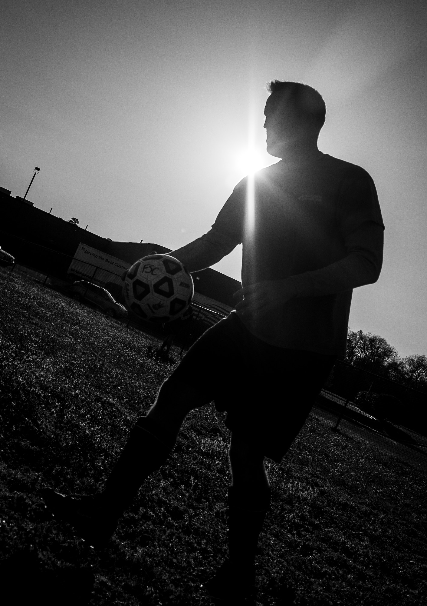 Andrew Gravett, 437th Aircraft Maintenance Squadron intramural soccer team coach, places the ball at mid-field for the start of the game against the 437th Aerial Port Squadron intramural soccer team March 14, 2013, at the Joint Base Charleston – Air Base soccer fields. The 437th AMXS soccer team squeaked by the 437th APS soccer team in a 4 – 2 shootout win in Joint Base Charleston’s 2013 intramural soccer season opener. (U.S. Air Force photo/ Senior Airman Dennis Sloan)