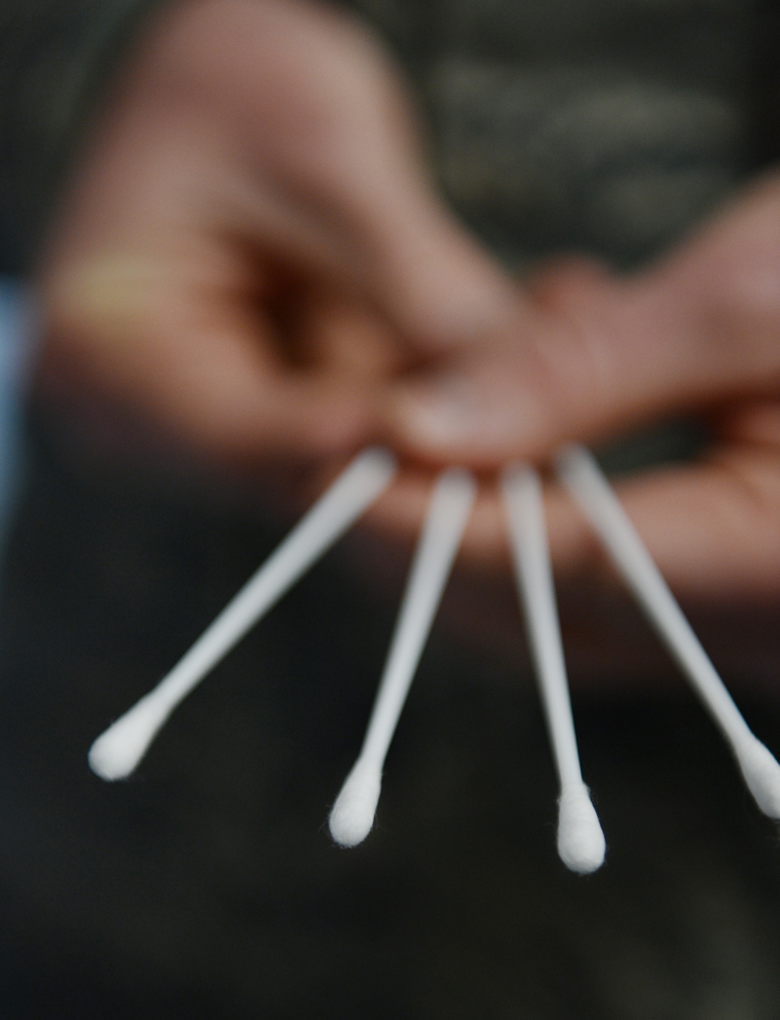 Four cotton swabs collect saliva samples from four corners of each registrants' mouth for the C.W. Bill Young Department of Defense marrow donor program at Shaw Air Force Base, S.C., March 18, 2013. The C.W. Bill Young DoD marrow donor program officially kicked off at the deployment processing center and will continue throughout the week at different locations. (U.S. Air Force photo by Senior Airman Tabatha Zarrella/Released)
