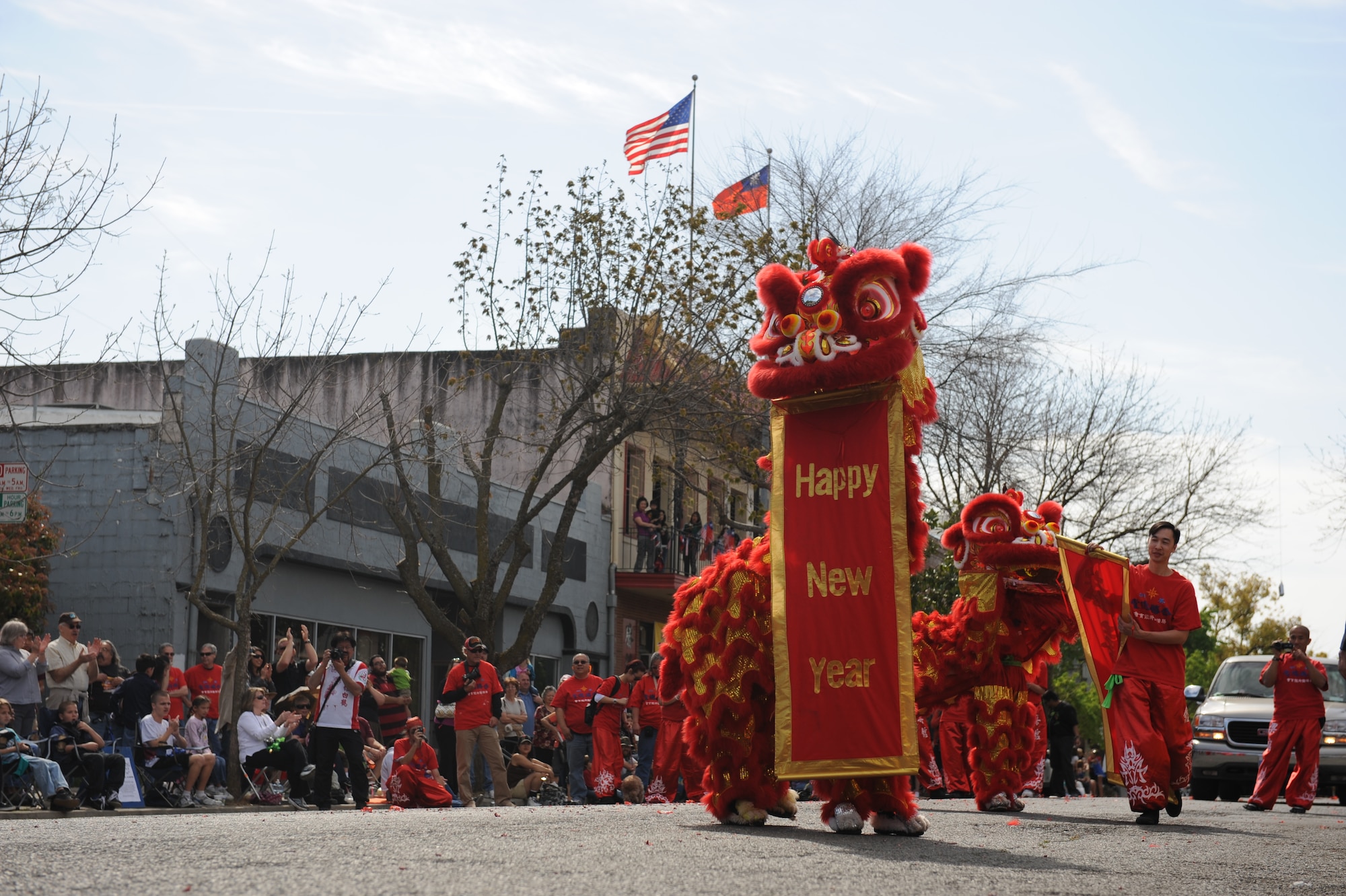Lion dancers hold up “Happy New Year” banners during the Bok Kai Festival in Marysville, Calif., March 16, 2013. The festival has been held in Marysville for 133 years. (U.S. Air Force photo by Staff Sgt. Robert M. Trujillo/Released)