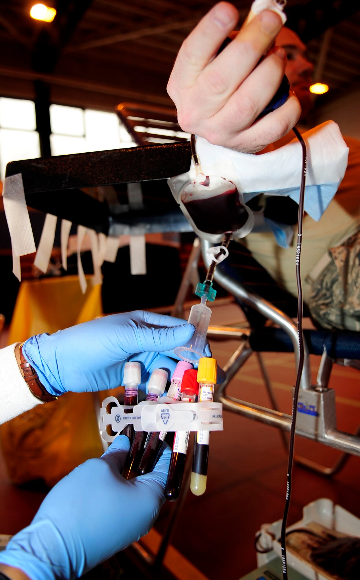 An Armed Services Blood Program medical lab technician fills test tubes with donor blood during the blood drive March 19, 2013, on RAF Mildenhall, England. The ASBP’s goal is to be a preeminent quality, cost effective blood bank providing blood products and services wherever and whenever needed. (U.S. Air Force photo by Senior Airman Ethan Morgan)