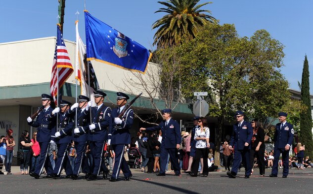 Beale Air Force Base Honor Guard and 9th Reconnaissance Wing leadership participate in the Bok Kai Festival in Marysville, Calif., March 16, 2013. The event featured a variety of floats, cultural performances and the Bok Kai parade dragon. (U.S. Air Force photo by Staff Sgt. Robert M. Trujillo/Released)