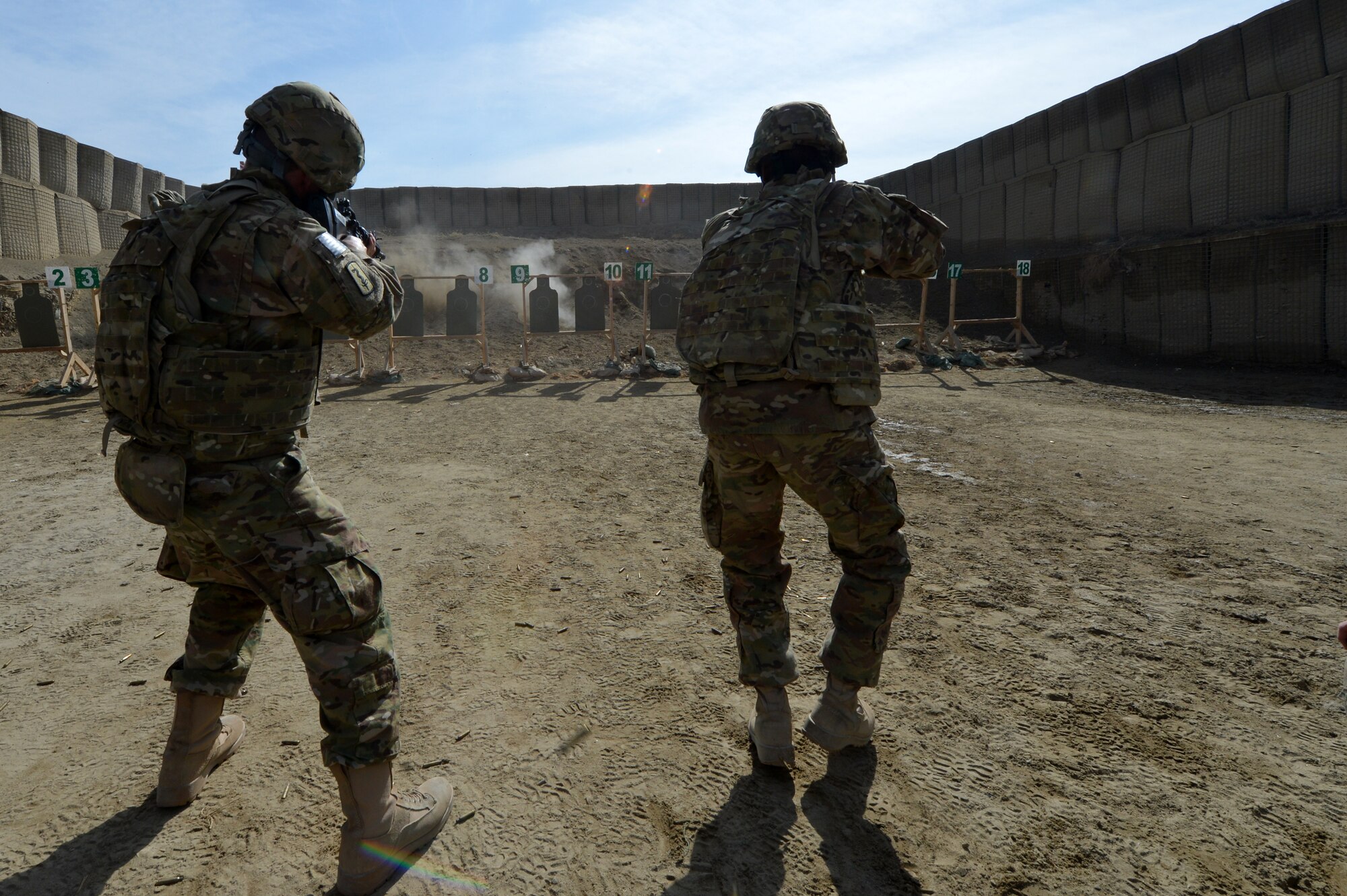 Airmen fire at targets during an “active shooter” training scenario on Bagram Airfield, Afghanistan, March 7, 2013.  During the course Airmen are told to fire starting from a seated position and also while moving towards the target.  (U.S. Air Force photo/Senior Airman Chris Willis)
